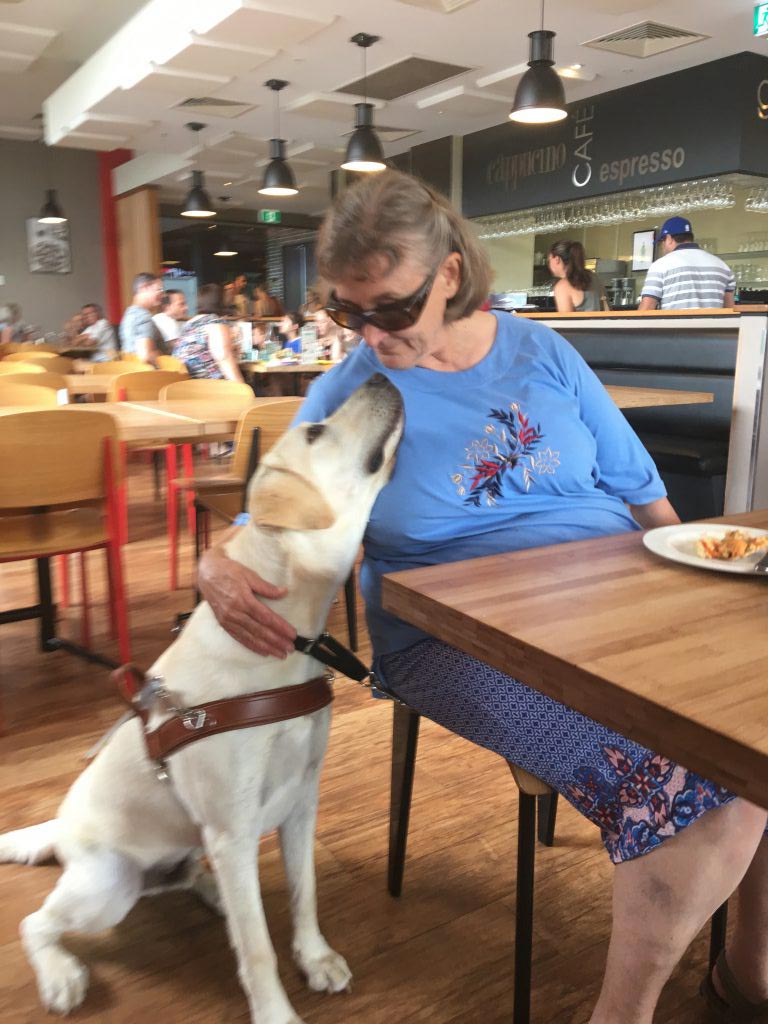 Wendy and Amos sharing a moment at a restaurant